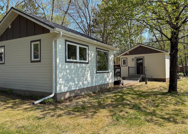 11445 State Highway 48, Trade Lake, WI 54853 - back of house featuring a yard and board and batten siding