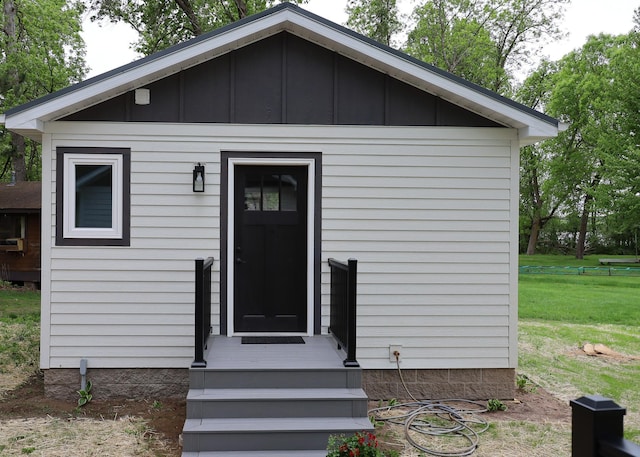 11445 State Highway 48, Trade Lake, WI 54853 - view of front of property featuring board and batten siding and a front lawn