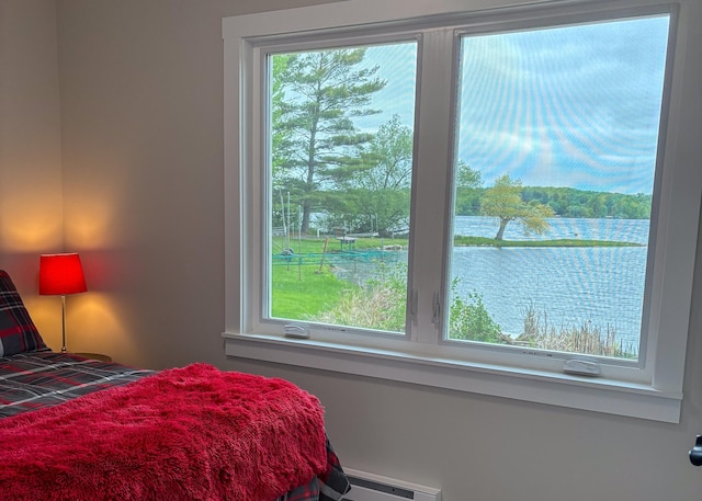 11445 State Highway 48, Trade Lake, WI 54853 - bedroom featuring a baseboard heating unit and a water view