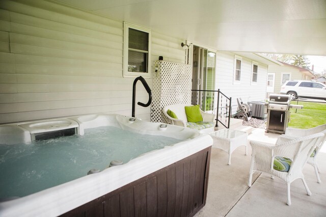 view of patio / terrace featuring a hot tub