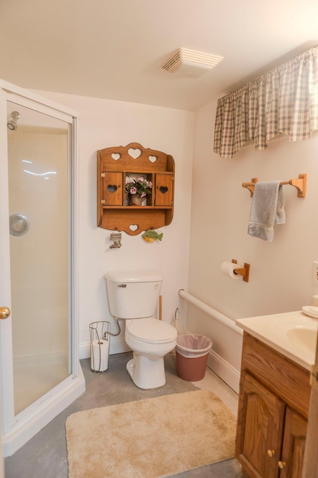 full bath with a stall shower, toilet, and vanity