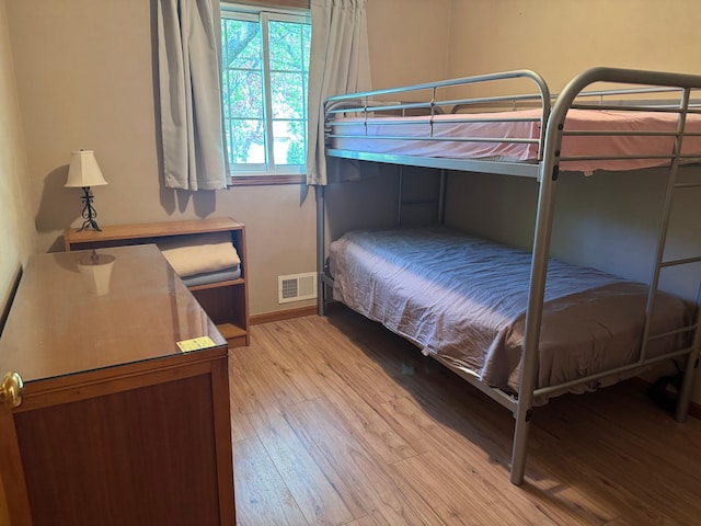 1601 8th Ave NE, Owatonna, MN 55060 - bedroom featuring light wood-style flooring and baseboards