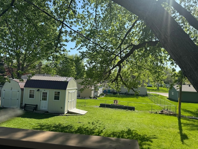 1601 8th Ave NE, Owatonna, MN 55060 - view of yard featuring a storage unit and an outbuilding