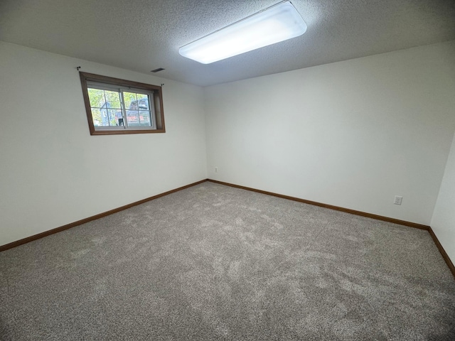 1601 8th Ave NE, Owatonna, MN 55060 - carpeted empty room with a textured ceiling and baseboards