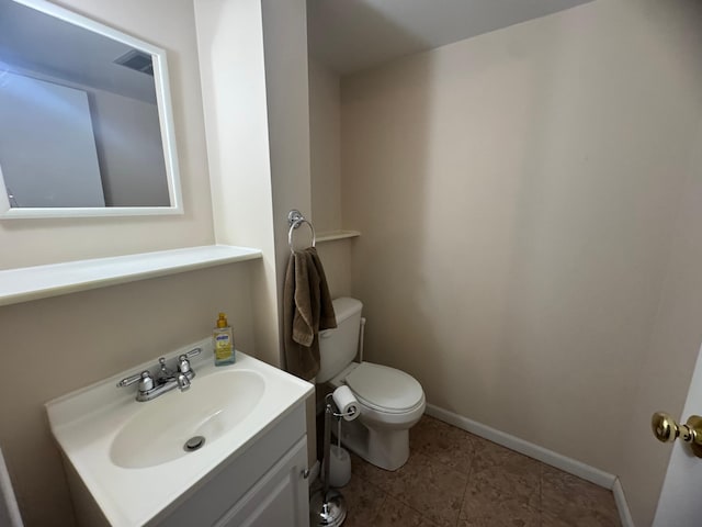 1601 8th Ave NE, Owatonna, MN 55060 - bathroom featuring toilet, vanity, baseboards, and tile patterned floors