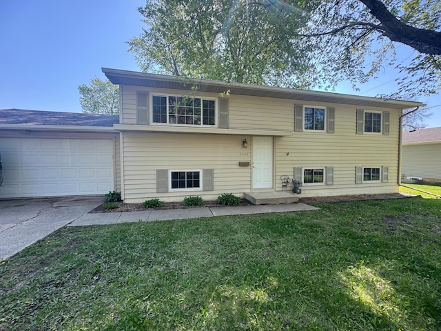 1601 8th Ave NE, Owatonna, MN 55060 - view of front of house featuring a front lawn, an attached garage, and driveway