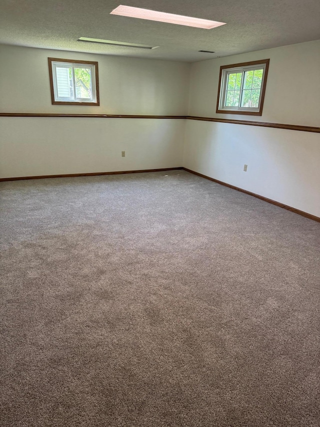 1601 8th Ave NE, Owatonna, MN 55060 - carpeted spare room with a textured ceiling and baseboards