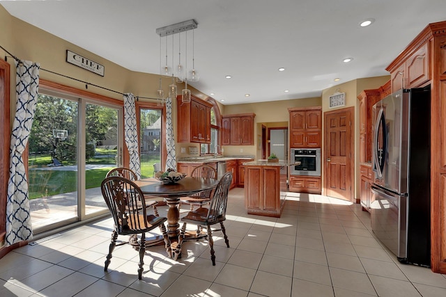 dining area with light tile patterned flooring and recessed lighting