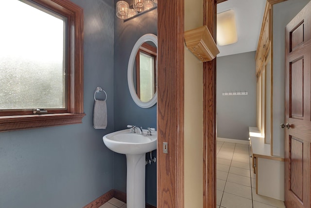 bathroom with tile patterned floors and baseboards