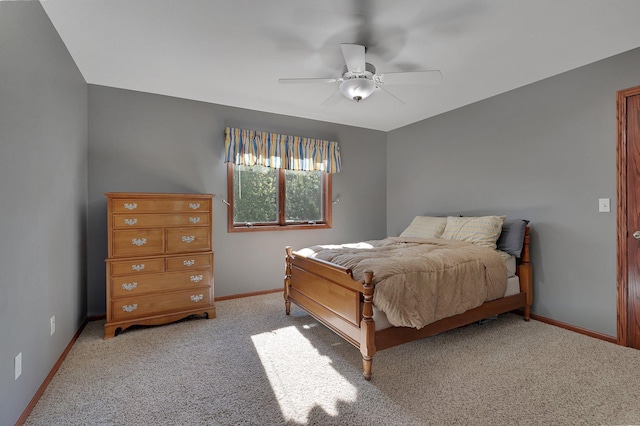bedroom featuring carpet, baseboards, and a ceiling fan