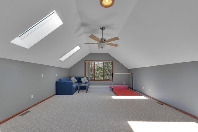 bonus room with a skylight, ceiling fan, lofted ceiling, baseboards, and carpet