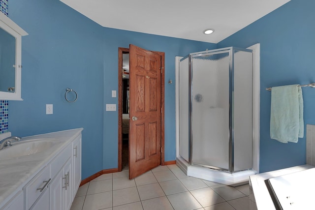 full bath with a shower stall, tile patterned flooring, vanity, connected bathroom, and baseboards
