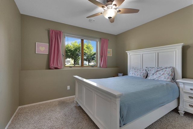 bedroom with light carpet, baseboards, and ceiling fan