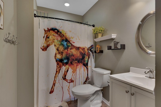 bathroom with toilet, vanity, baseboards, and a shower with shower curtain
