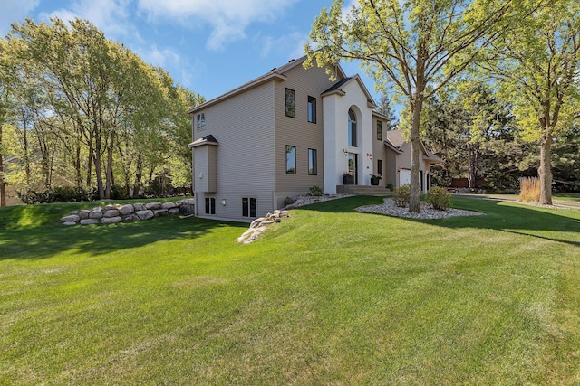 view of home's exterior with a yard
