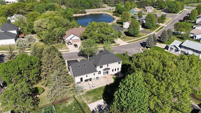 view of property location with nearby suburban area and a large body of water