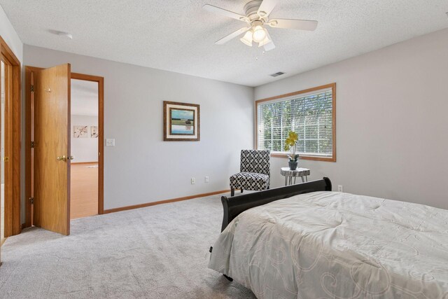 1515 Yorkshire Ln, Shakopee, MN 55379 - carpeted bedroom featuring a textured ceiling and ceiling fan