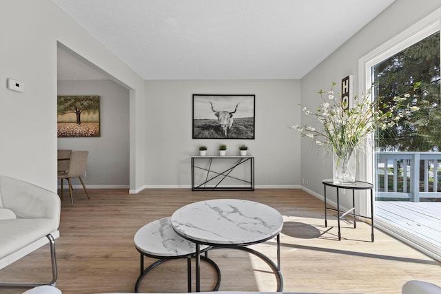 sitting room with wood finished floors and baseboards