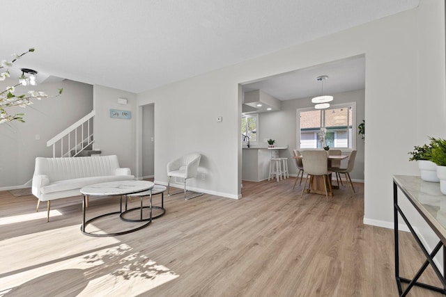 living room with wood finished floors and baseboards