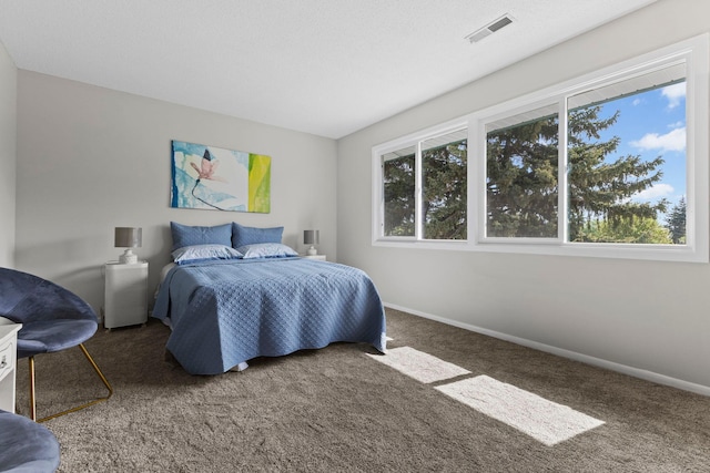 bedroom with carpet and baseboards