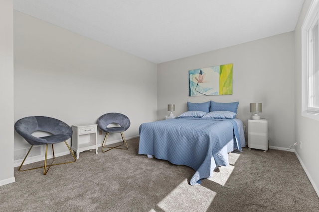 carpeted bedroom with baseboards