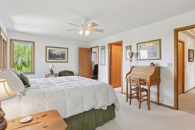 32875 Stanton Trl, Cannon Falls, MN 55009 - bedroom with light carpet, a ceiling fan, and baseboards