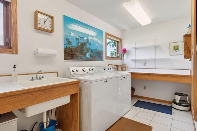 32875 Stanton Trl, Cannon Falls, MN 55009 - laundry area featuring separate washer and dryer, light tile patterned floors, and a textured ceiling