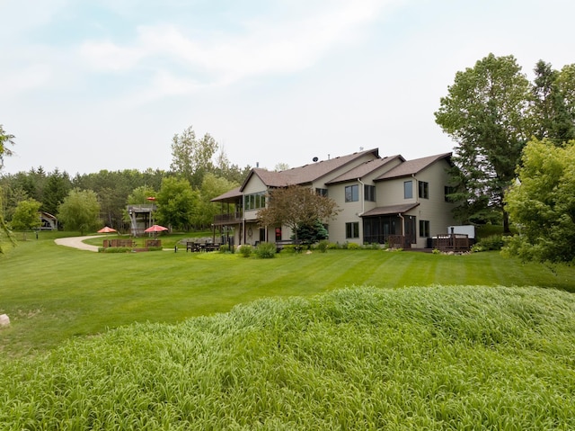 32875 Stanton Trl, Cannon Falls, MN 55009 - view of grassy yard with a wooden deck