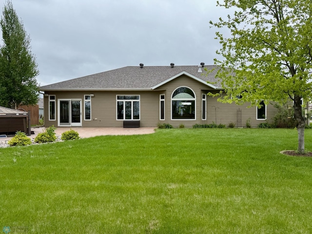 3823 43rd Ave S, Moorhead, MN 56560 - back of house featuring a patio area, a yard, and roof with shingles