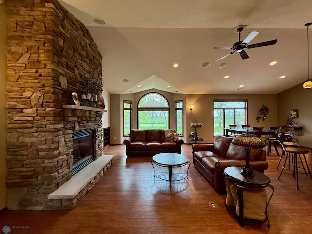 3823 43rd Ave S, Moorhead, MN 56560 - living room with lofted ceiling, a ceiling fan, a stone fireplace, wood-type flooring, and recessed lighting