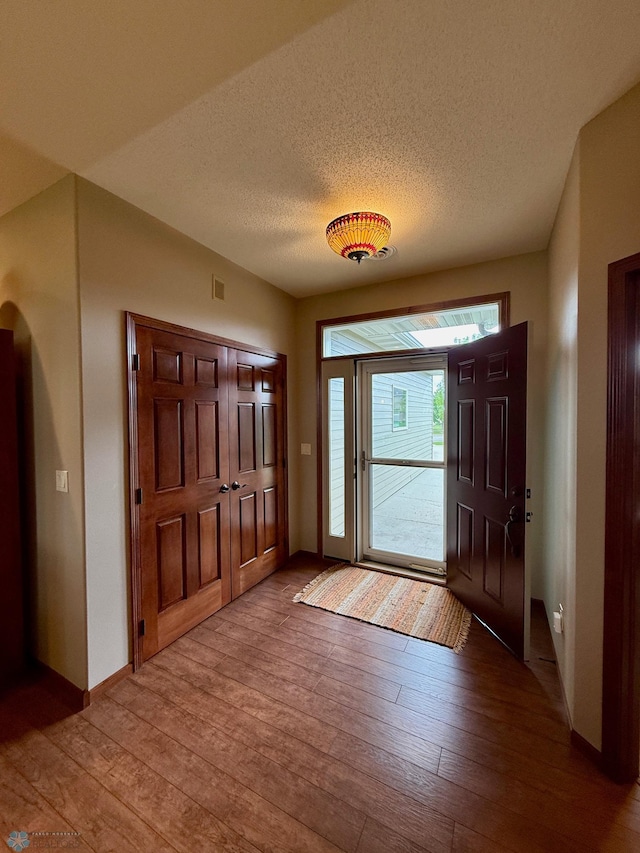 3823 43rd Ave S, Moorhead, MN 56560 - entrance foyer with hardwood / wood-style floors, a textured ceiling, and baseboards
