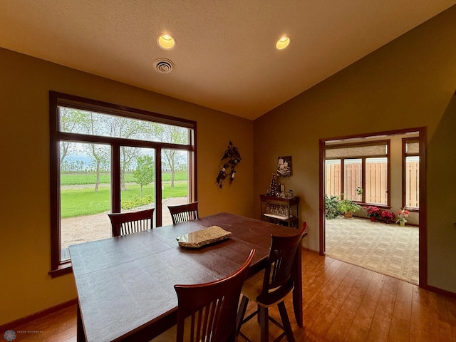 3823 43rd Ave S, Moorhead, MN 56560 - dining space featuring plenty of natural light, lofted ceiling, recessed lighting, wood-type flooring, and baseboards