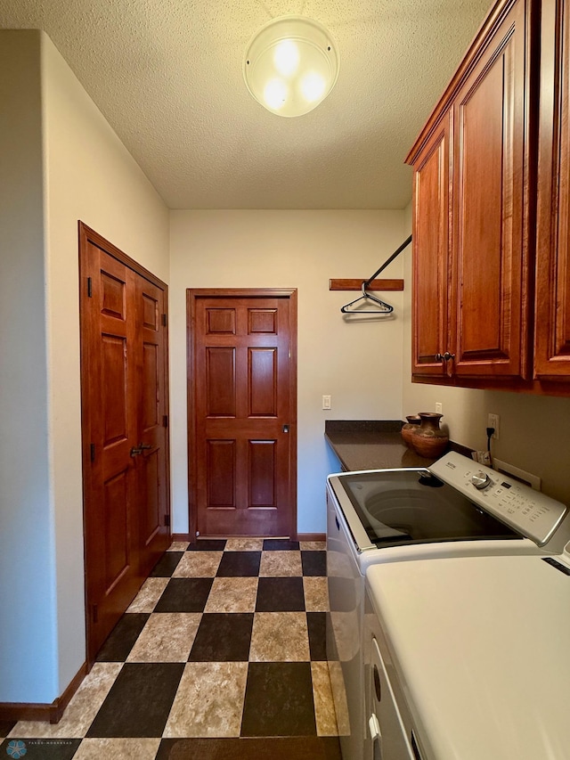 3823 43rd Ave S, Moorhead, MN 56560 - laundry room featuring cabinet space, independent washer and dryer, baseboards, and a textured ceiling