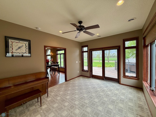 3823 43rd Ave S, Moorhead, MN 56560 - living area with light colored carpet, baseboards, ceiling fan, a textured ceiling, and recessed lighting