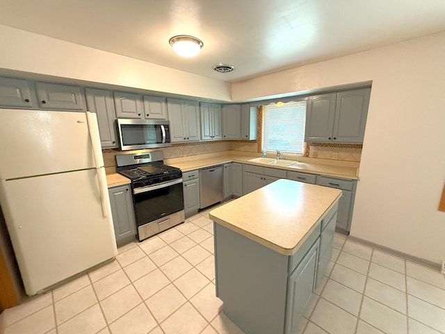 1611 Graydon Ave, Brainerd, MN 56401 - kitchen with appliances with stainless steel finishes, gray cabinets, light countertops, and light tile patterned floors