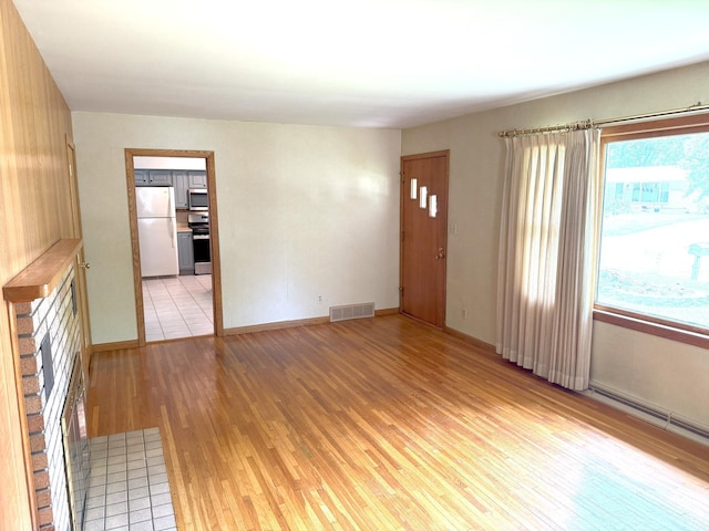 1611 Graydon Ave, Brainerd, MN 56401 - unfurnished living room with light wood finished floors and baseboards