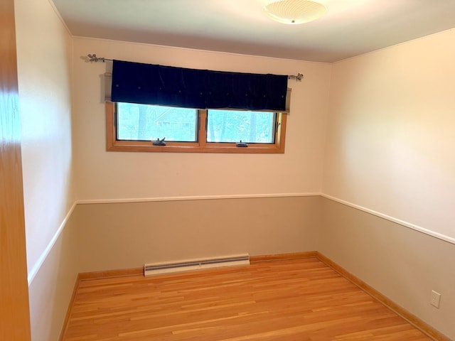 1611 Graydon Ave, Brainerd, MN 56401 - unfurnished room featuring a baseboard radiator and light wood-style flooring