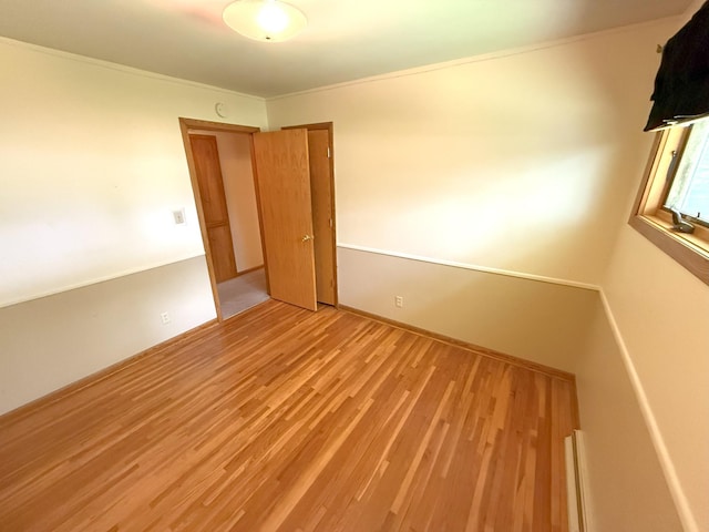 1611 Graydon Ave, Brainerd, MN 56401 - spare room with light wood finished floors and crown molding