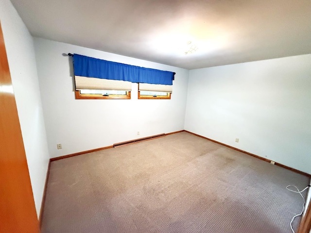 1611 Graydon Ave, Brainerd, MN 56401 - spare room featuring a baseboard radiator and carpet flooring