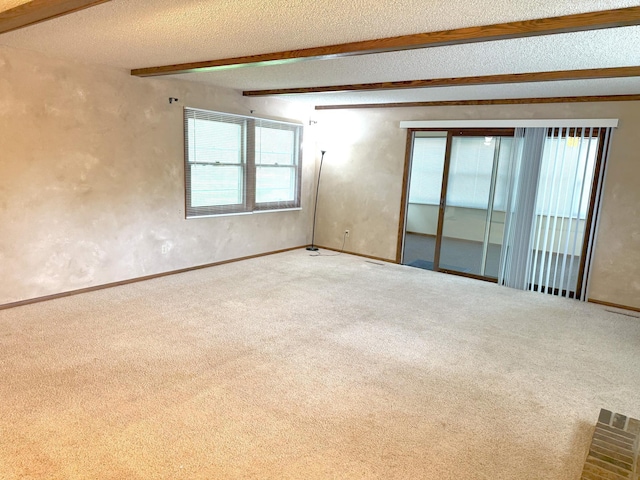 1611 Graydon Ave, Brainerd, MN 56401 - carpeted empty room with beamed ceiling and a textured ceiling