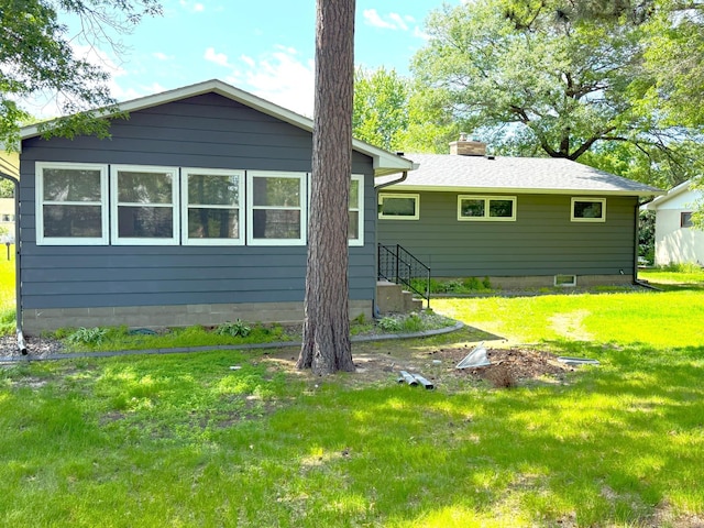 1611 Graydon Ave, Brainerd, MN 56401 - back of house featuring a lawn and a chimney