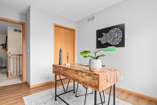 office featuring light wood-style floors and baseboards