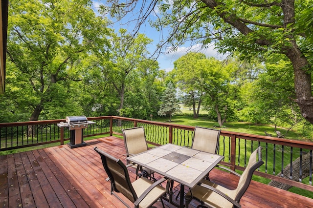 5651 164th Ln NW, Ramsey, MN 55303 - wooden terrace featuring outdoor dining space, grilling area, and a lawn