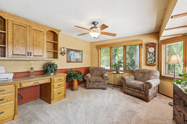 5651 164th Ln NW, Ramsey, MN 55303 - office space with ceiling fan, light carpet, built in desk, and a textured ceiling