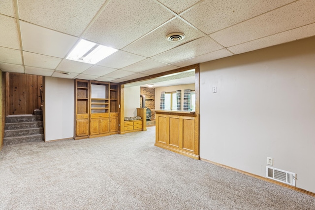5651 164th Ln NW, Ramsey, MN 55303 - unfurnished room with a paneled ceiling, light colored carpet, stairway, and baseboards