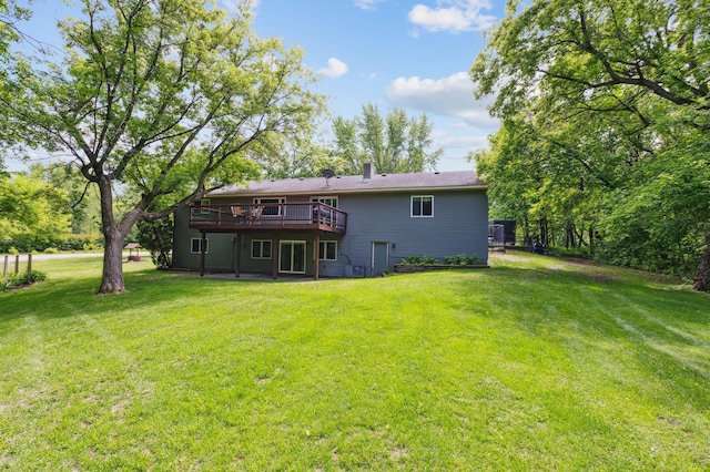 5651 164th Ln NW, Ramsey, MN 55303 - rear view of house featuring a wooden deck, a yard, and a chimney