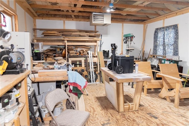 miscellaneous room with a workshop area