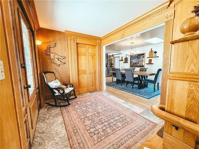 entrance foyer featuring a chandelier and wood finished floors