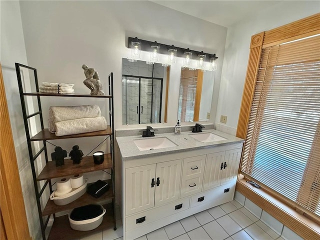 full bathroom with a shower stall, tile patterned floors, and double vanity