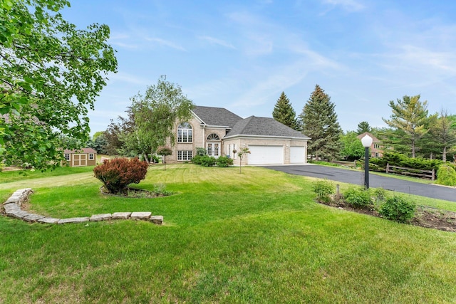 2001 Stonepine Ave, Hudson, WI 54016 - traditional-style house featuring a garage, driveway, and a front yard